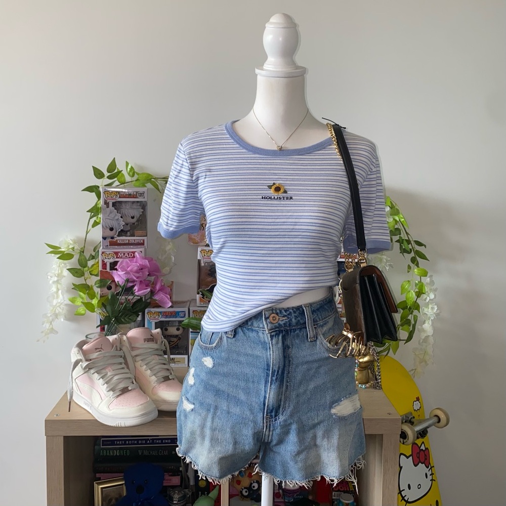 blue and white striped Hollister Co. baby tee with sunflower embroidery